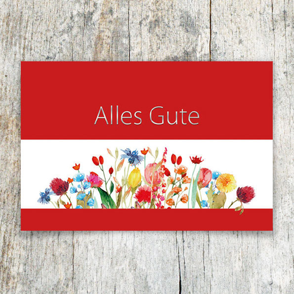 Vergrößerte Abbildung Rote Glückwunschkarten mit bunten Wiesenblumen und silbernem Schriftzug Alles Gute auf dunkelrotem Hintergrund